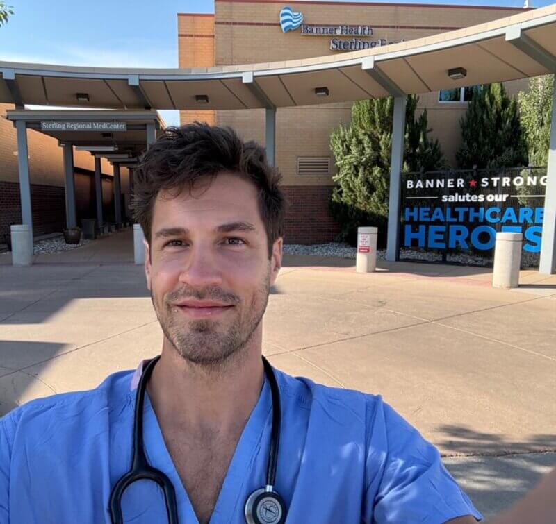 Dr. Bill Brandenburg Smiling Outside of Rural Hospital